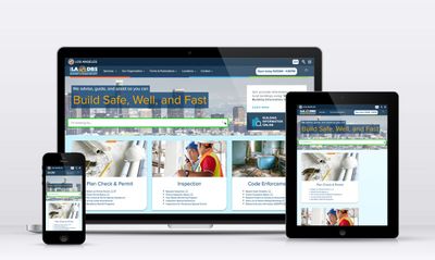 Colorful responsive designs of a website, with the City of Los Angeles navbar at the top and the tagline `We advice, guide, and assist so you can build safe, well, and fast` over a hero image of the Los Angeles downtown skyline.