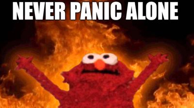 A deranged Elmo raises his hands in a background of fire, with 'Never Panic Alone' captioned above.