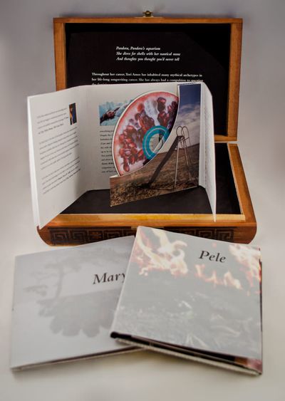 Open box and CD set, showing a pomogranate label on the CD.