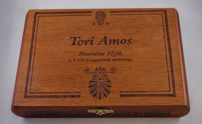 Cigar box with burned-in details, titled Tori Amos, Feminine Myth, a 3-CD biographical anthology.