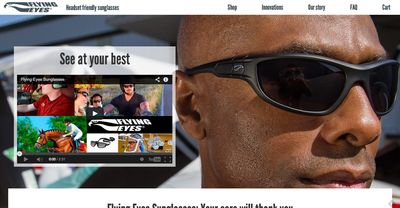 Closeup of the Flying Eyes homepage, showing a large hero image of a Black man wearing thin sunglasses.